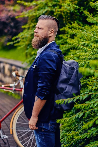 Stylish bearded male with backpack