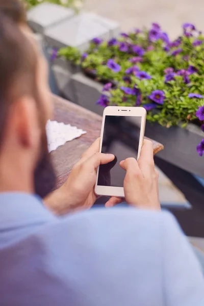 Stylish bearded male using smartphone. — Stock Photo, Image