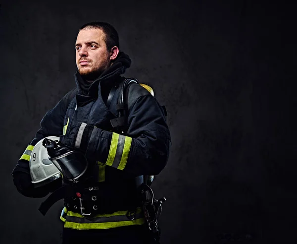 Firefighter holds safety helmet. — Stock Photo, Image