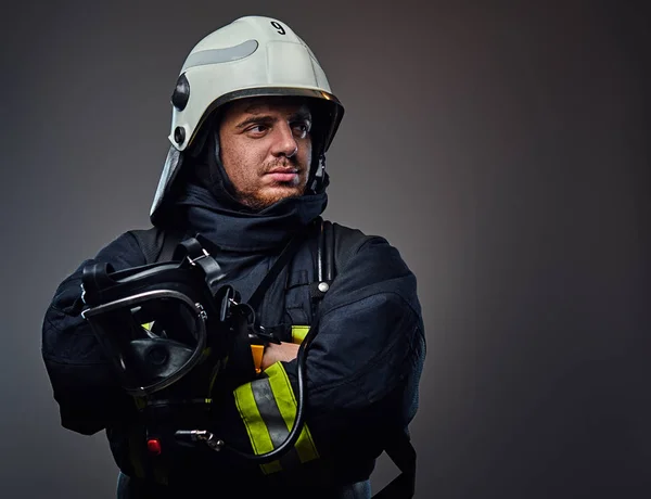 Firefighter in uniform and safety helmet. — Stock Photo, Image