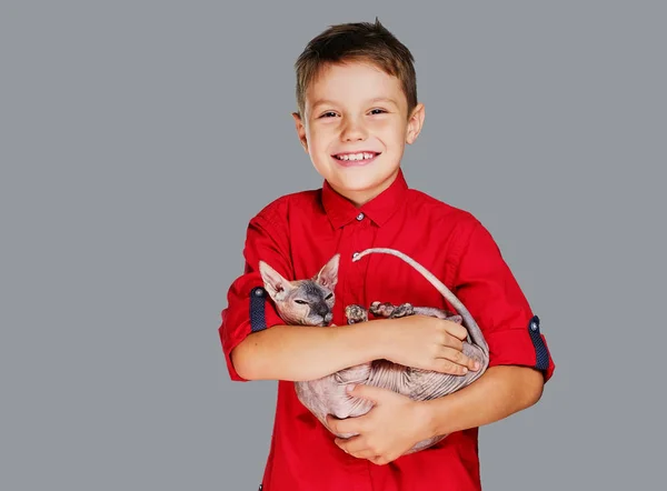 Emotional little boy in a red polo — Stock Photo, Image