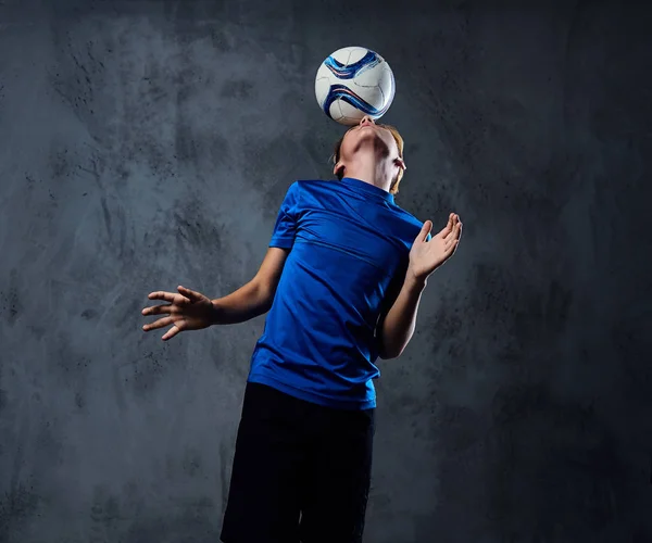 Blond teenager plays with a ball. — Stock Photo, Image