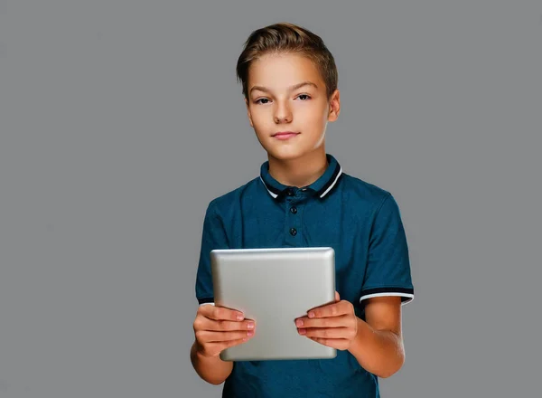 Boy holds tablet PC — Stock Photo, Image