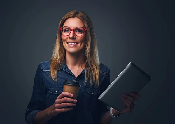 Blondy woman holds tablet PC — Stock Photo, Image