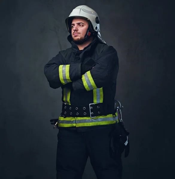 Studio portrait of firefighter dressed in uniform. — Stock Photo, Image