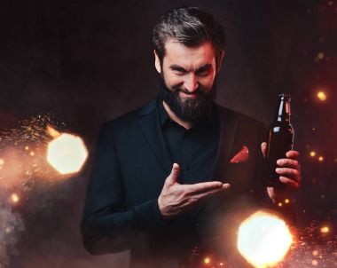 Man in suit holds bottle of craft beer clipart