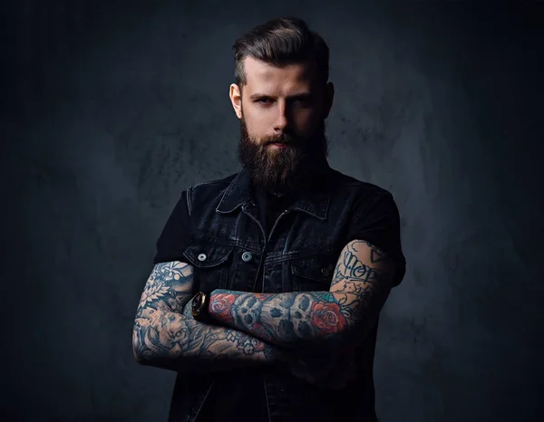 Bearded hipster male with tattoos on his arms — Stock Photo, Image