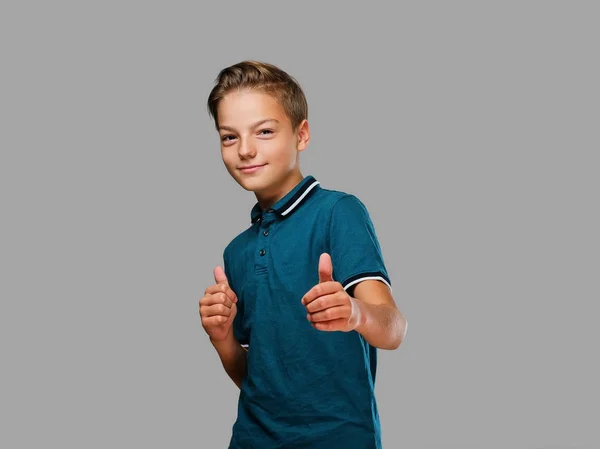 Teenager boy shows big finger up. — Stock Photo, Image