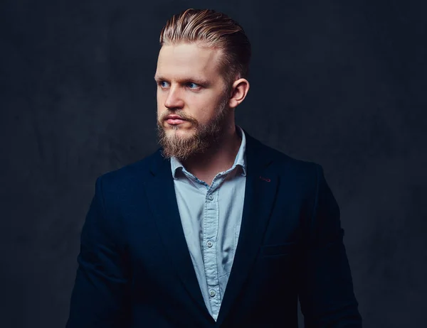 Portrait of stylish blond bearded male dressed in a suit. — Stock Photo, Image