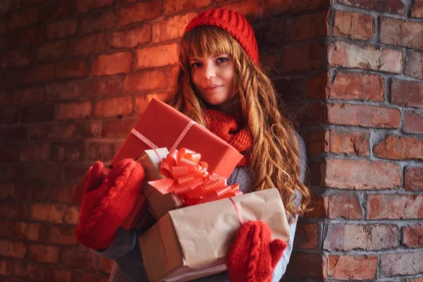 Redhead female  holds Christmas gifts — Stock Photo, Image