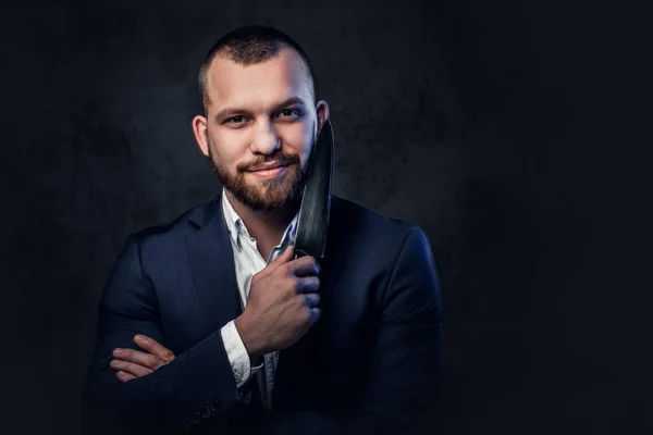 Man in a suit holds a Chef's knife — Stock Photo, Image
