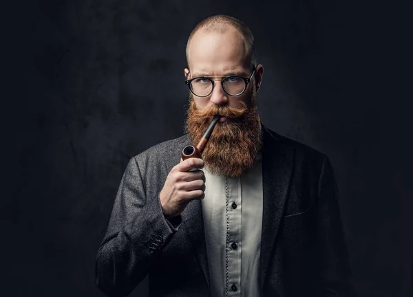 Portrait Bearded Redhead Russian Male Smoking Pipe Grey Background — стоковое фото