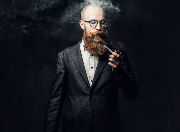 Portrait Bearded Redhead Russian Male Smoking Pipe Grey Background — стоковое фото