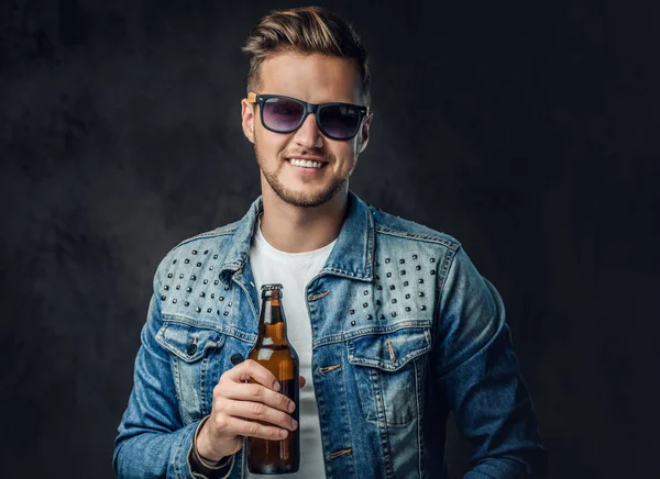 Positive Blond Male Dressed Denim Jacket Sunglasses Holds Bottle Craft — Stock Photo, Image