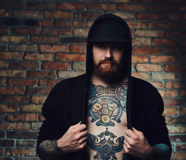 redhead bearded male with tattoos