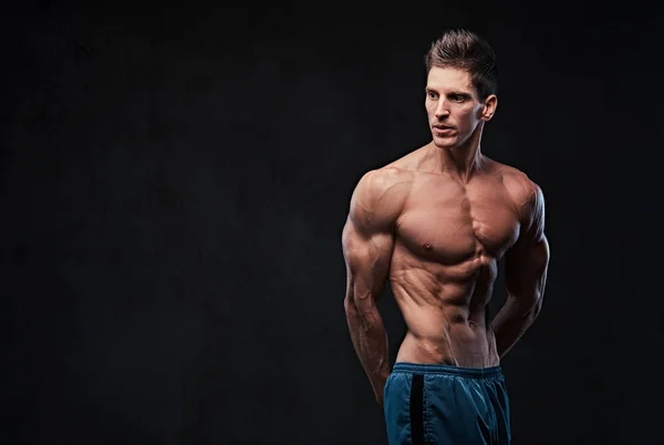 Shirtless male shows triceps. — Stock Photo, Image