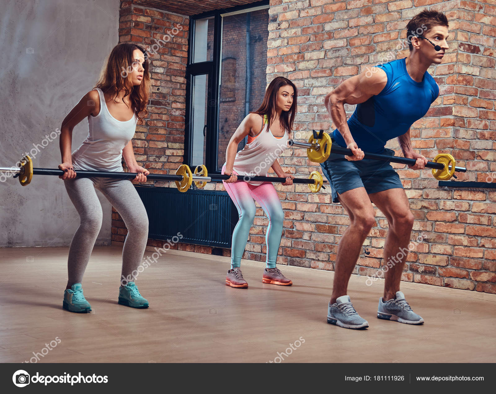 Male Fitness Coach Shows How Back Workouts Barbell Stock Photo by