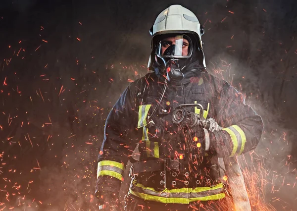 Professional Firefighter Dressed Uniform Oxygen Mask Standing Fire Sparks Smoke — Stock Photo, Image