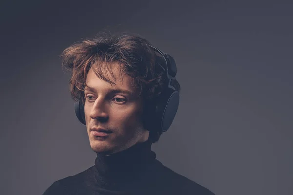 Portrait Creative Sensual Male Black Sweater Listening Music Headphones — Stock Photo, Image
