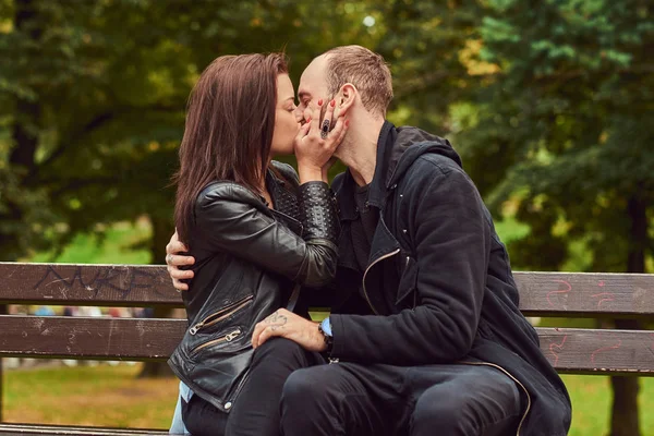 Attractive Modern Couple Kissing Date While Cuddling Bench Park Enjoying — Stock Photo, Image