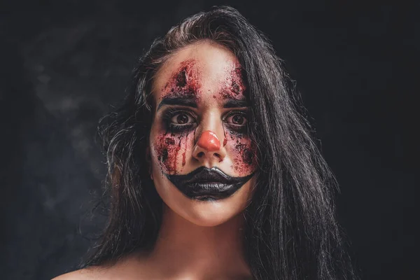 Young woman is playing a role of evil clown — Stock Photo, Image