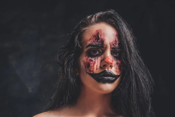 Young woman is playing a role of evil clown — Stock Photo, Image