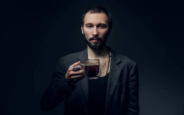 Portrait of bearded hipster with cup of drink — Stok fotoğraf