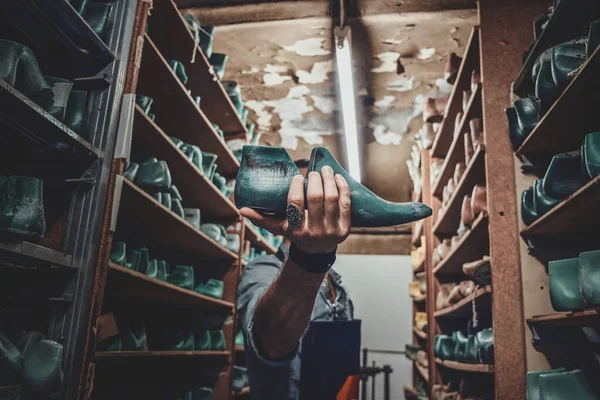 Cobbler foung shoe form at his storage