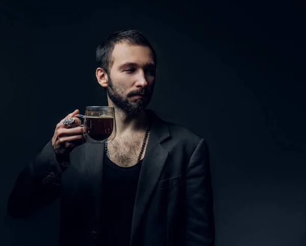 Portrait of bearded hipster with cup of drink — Stok fotoğraf