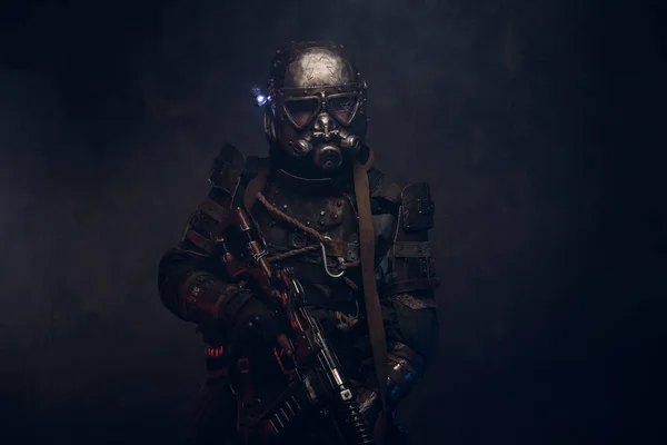 Cyborg with weapon in mist and smoke — ストック写真