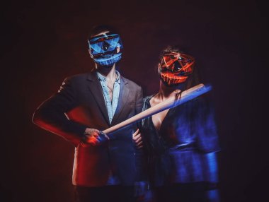 Portrait of crazy couple in masks with bat clipart