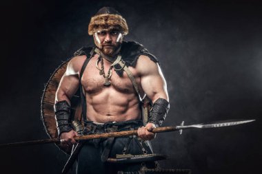 Severe barbarian in warrior clothes clipart