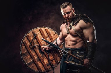 Severe barbarian in warrior clothes clipart