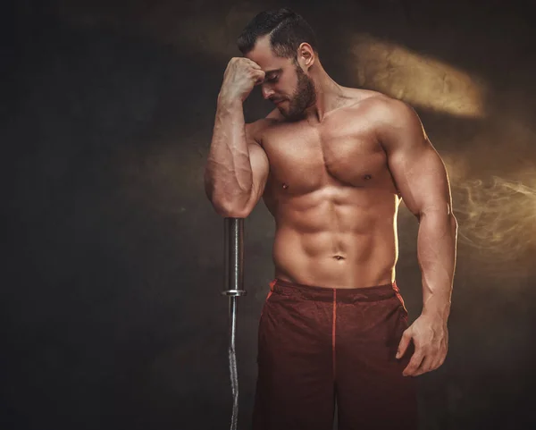 Young shirtless bodybuilder has a photo session — Stock Photo, Image