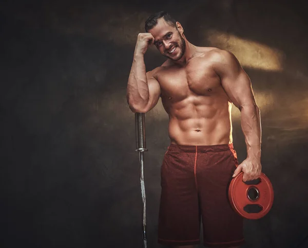 Young shirtless bodybuilder has a photo session — Stock Photo, Image