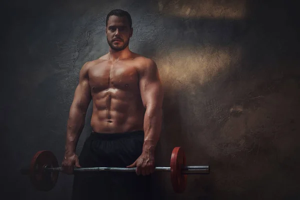 Young shirtless bodybuilder has a photo session — Stock Photo, Image