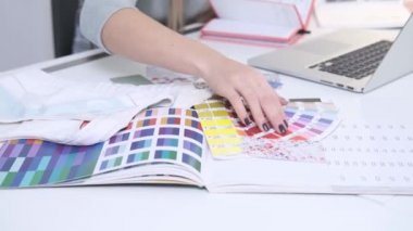 Young woman is working in the light office