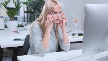 Attractive girl is working in the office