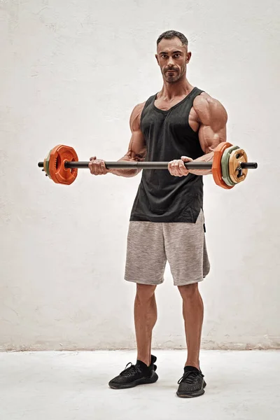 Athletic Man Doing Biceps Exercise Barbell Isolated White Concrete Background — Stock Photo, Image
