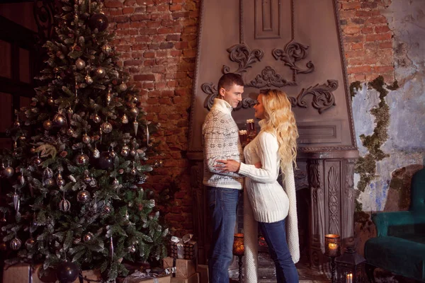 Merry Christmas. Young couple celebrating New Year at home. — Stock Photo, Image