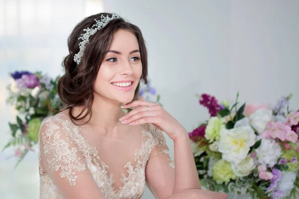 Portrait of beautiful girl in a luxurious wedding dress. Bride with beautiful decoration in her hair, smiling — Stock Photo, Image