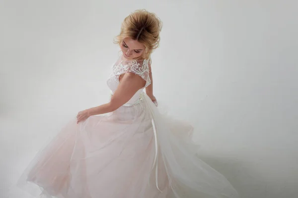 Portrait of a beautiful girl in a wedding dress. Dancing Bride, white background. Top view — Stock Photo, Image