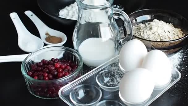 Cooking oatmeal cookies with cranberries. Ingredients for recipe, top view, flying camera — Stock Video