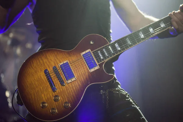 Guitarist on stage, guitar closeup — Stock Photo, Image