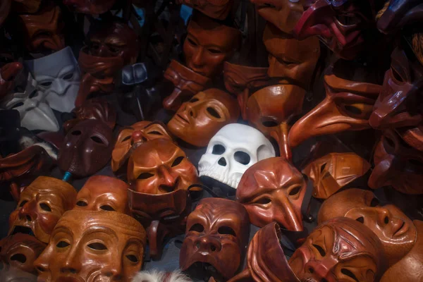 Mask in the form of the skull among the many simple masks — Stock Photo, Image