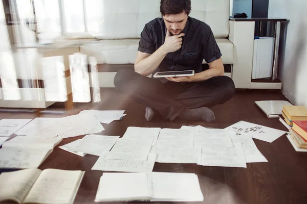 Creative approach to business, brainstorming sitting on the floor in the apartment. the double exposure effect — Stock Photo, Image