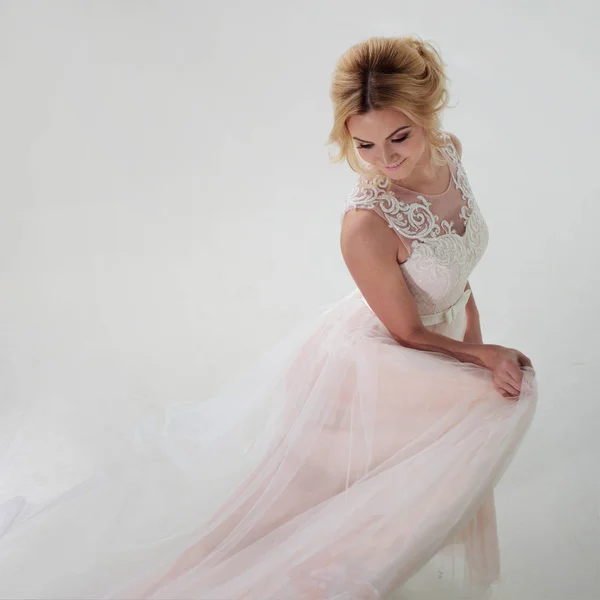 Portrait of a beautiful girl in a wedding dress. Dancing Bride, white background. Top view — Stock Photo, Image