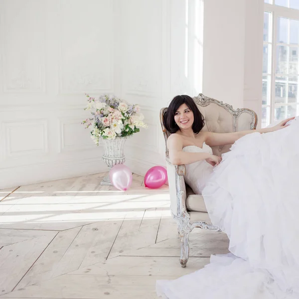 Young woman in wedding dress in luxury interior on the left place for some text or disign. — Stock Photo, Image