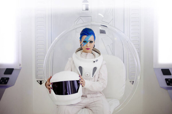 Woman astronaut on a futuristic spaceship.