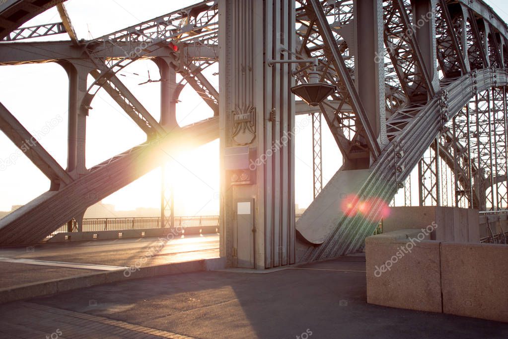 Metal structures of the bridge across river. Long-span steel trusses.